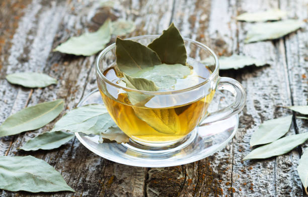 istock Cup of natural bay leaf herbal tea on wooden table 1326427772