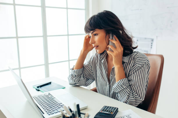 istock Female entrepreneur working in office on laptop 1326428829