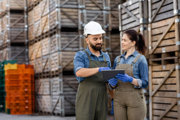 istock Professionals work in warehouse, check goods with device, collect order 1326428885