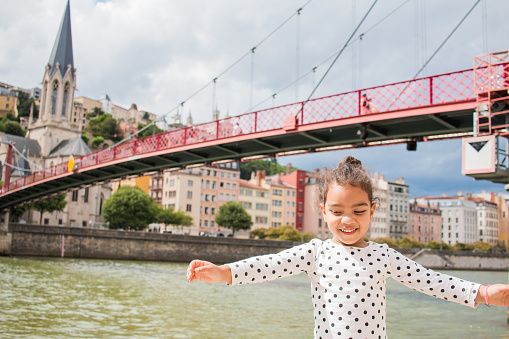 A little girl playing in the city of lyon