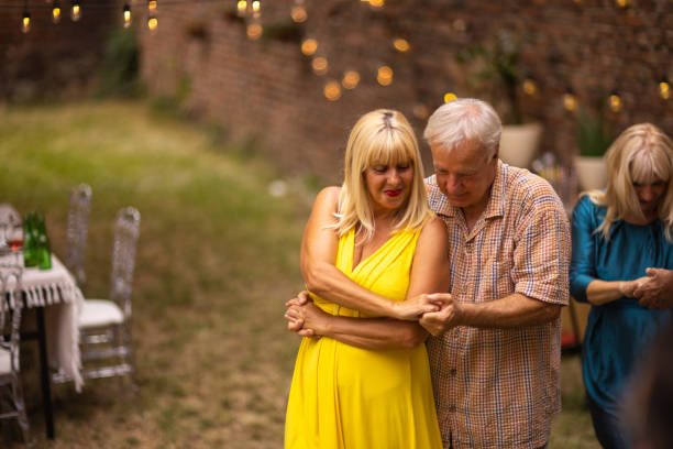 July 29, 2023. Belarus. Staraia Belitsa village. An elderly couple, a man and a woman, are dancing. They look at each other and talk.