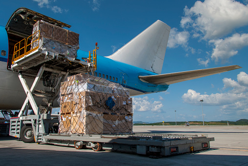 Loading cargo into an airplane.