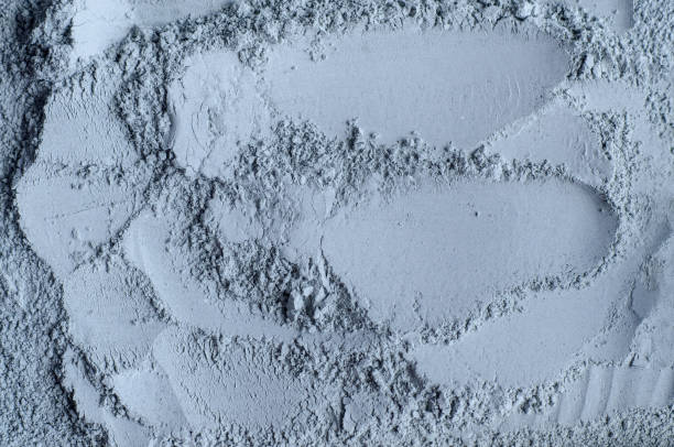 istock Gray, blue bentonite clay powder (alginate, facial mask, eye shadow, body wrap) texture close up, selective focus. Abstract background. 1326437934