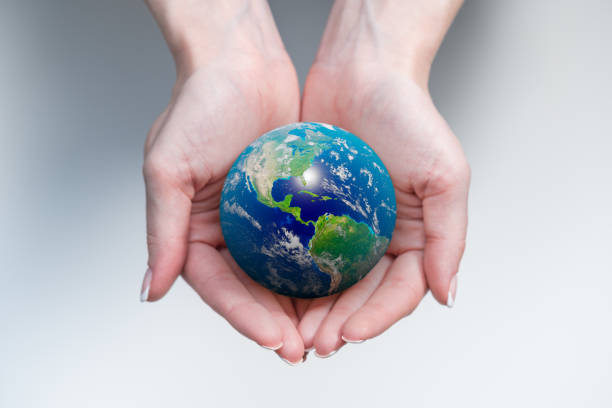 istock Planet Earth in a females hands 1326437944