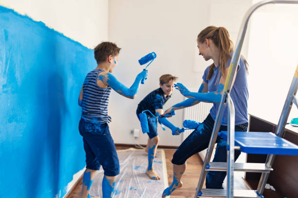 istock Kids having fun painting the room 1326439041