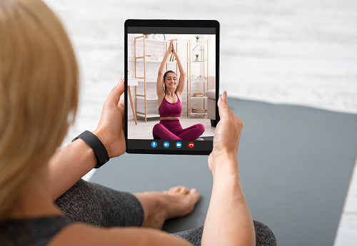 Online Training Concept. Woman Practicing Yoga Via Video Call With Instructor, Unrecognizable Female Exercising With Digital Tablet At Home, Having Web Conference With Female Coach, Creative Collage
