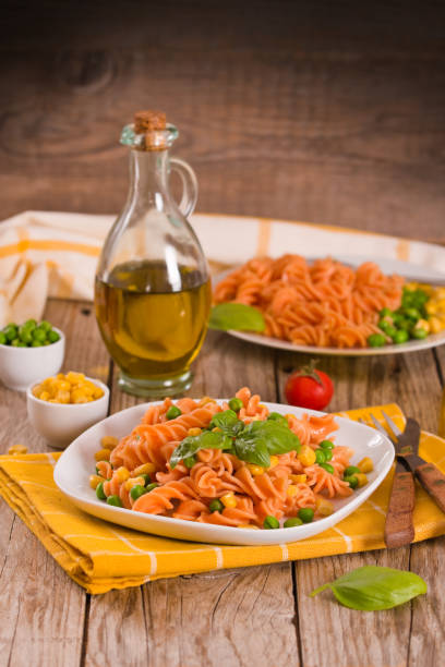 istock Fusilli pasta with peas and sweet corn. 1326441722
