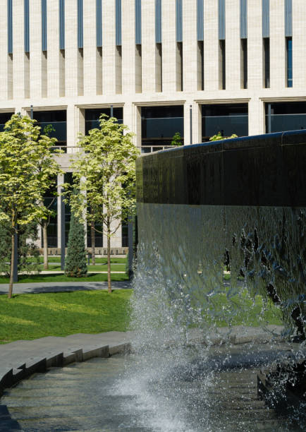 istock Waterfall flows in streams into granite bed of artificial river. Fountain 'Infinity' in form of huge bowl. Public landscape park 'Krasnodar' or 'Galitsky park'. 1326444718