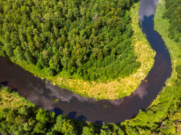istock beautiful landscape with a small meandering river (aerial view) 1326446336