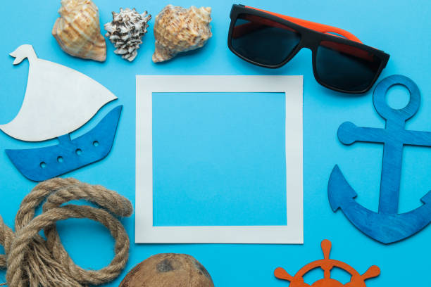 istock Summer frame. paper frame for your text, coconut and nautical rope and summer accessories on a bright light blue background. top view 1326448470