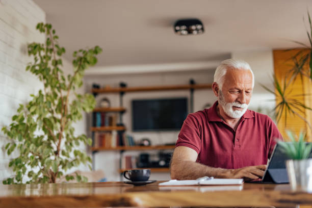 istock Mature man, having a drink, during a film. 1326452564