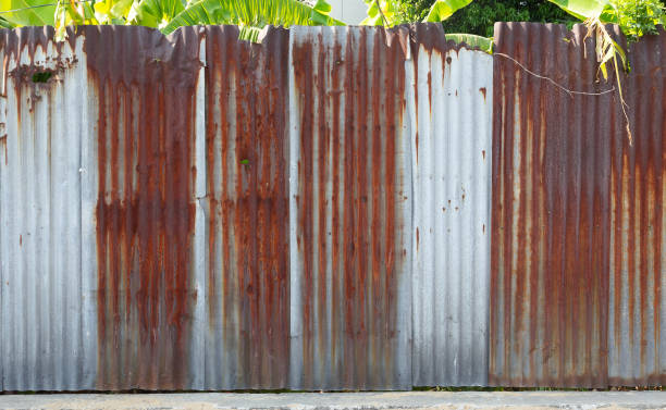 istock Rusted galvanized iron plate. Old rusty zinc sheet wall with Gourd. 1326454170