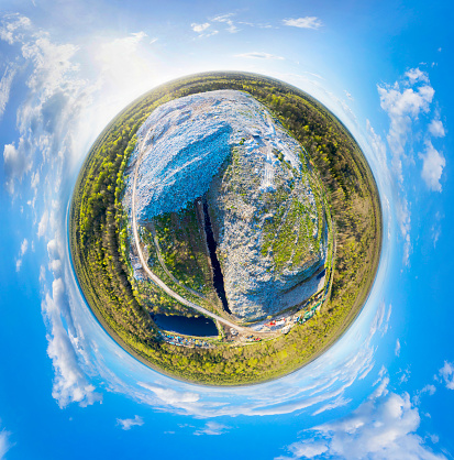 Spherical panorama of a landfill - shot from a drone quadrocopter. The symbol of a consumer society that has filled the entire planet, displacing all living things. Spherical panorama of a landfill - shot from a drone quadrocopter. The symbol of a consumer society that has filled the entire planet, displacing all living things. Gypsies live here and collect plastic in bags