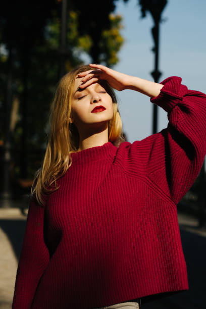 istock Tender blonde woman with red lips posing in sunny day 1326455698