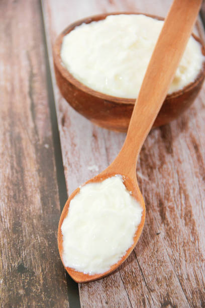istock white milk yogurt in a wooden spoon and plate 1326458550
