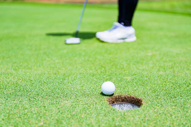 istock putter and golf ball on the green 1326463806