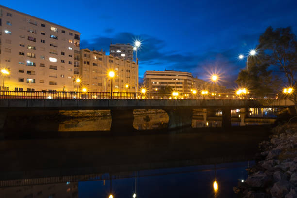istock View of bridge and river in Malaga at night 1326465265