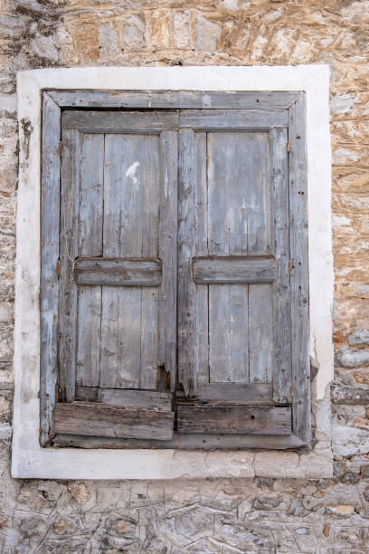 istock Old double closed wooden shutters. Vertical view. 1326466426