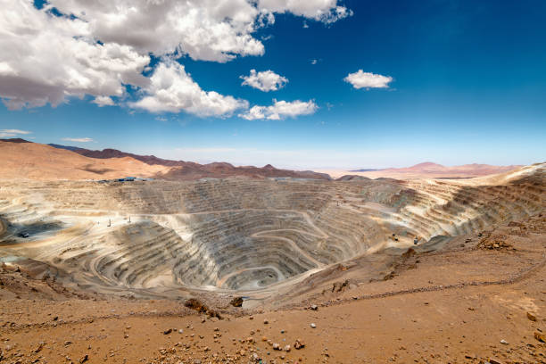 Open-pit copper mine View from above of the pit of an open-pit copper mine in Chile mining natural resources photos stock pictures, royalty-free photos & images