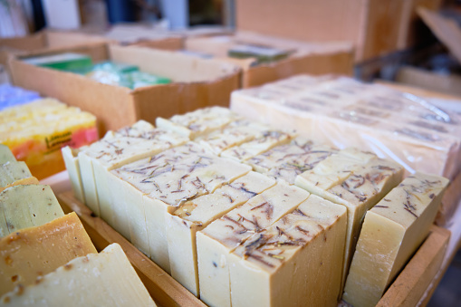 Craft multi-colored natural organic soap bars at shop shelf. Traditional soap manufacture, Mardin, Turkey