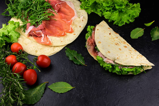 istock piadina with green salad, tomato, ham 1326467606