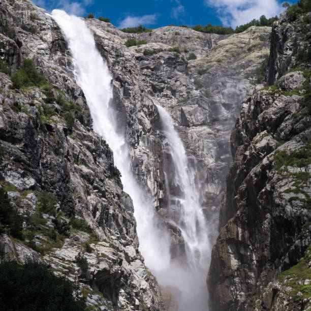 istock Waterfall in the mountains, glacial water falls from a great height 1326467993
