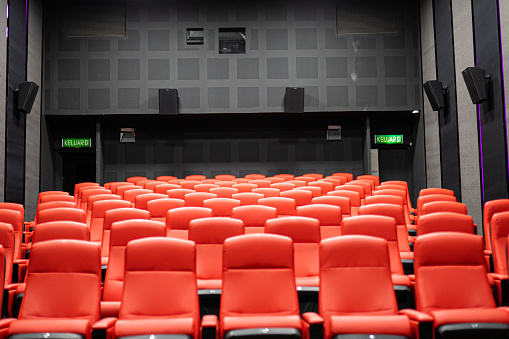 Wide shot, cinema hall with red color chair, no people