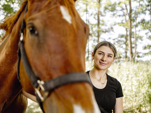 istock Young female trainer with her horse 1326470405