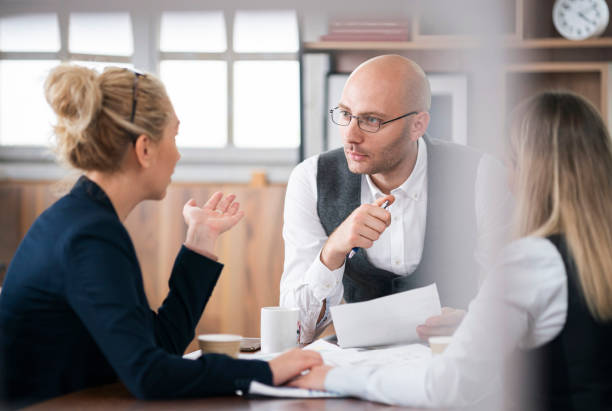 istock Financial advisor talking to Lesbian couple 1326472551
