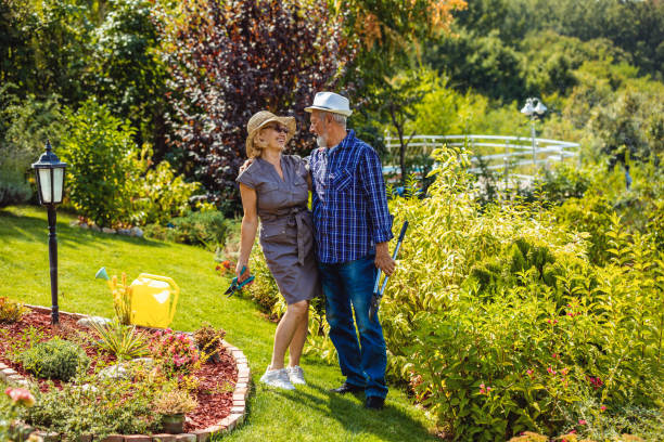 istock Happy senior couple standing in backyard 1326473663