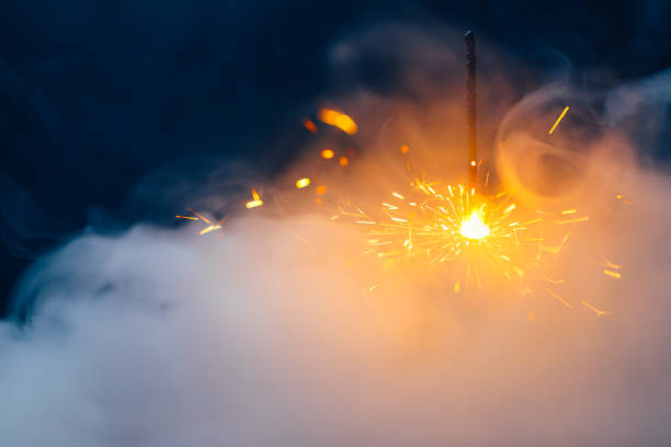 istock fire sparkler in dense smoke, abstract Christmas firework background 1326476395