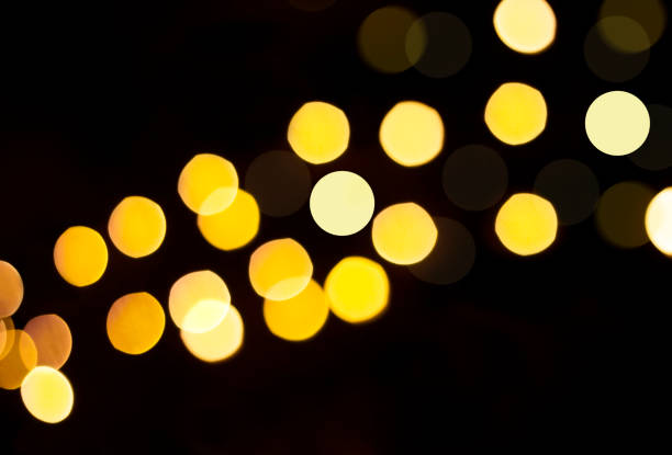 istock Yellow defocused lights on a black background. 1326478996