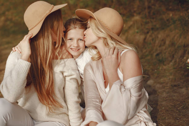istock Elegant mother with children in a summer forest 1326480077