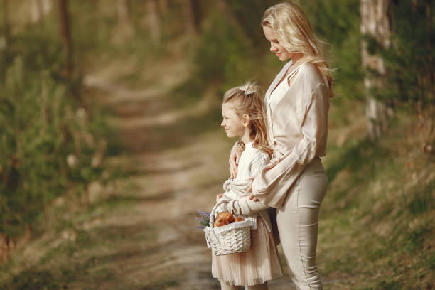 istock Elegant mother with daughter in a summer forest 1326480144