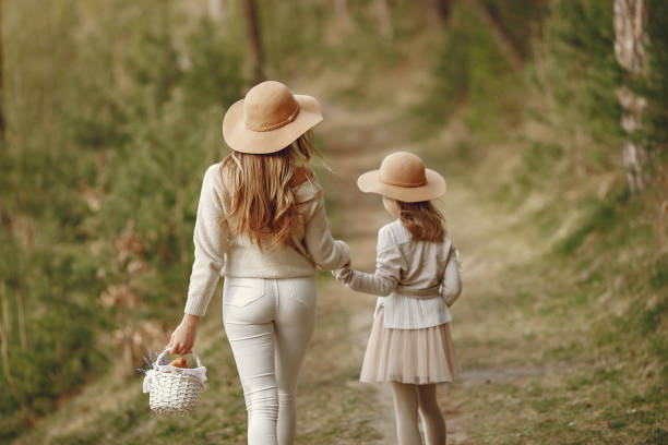 istock Elegant mother with daughter in a summer forest 1326480153