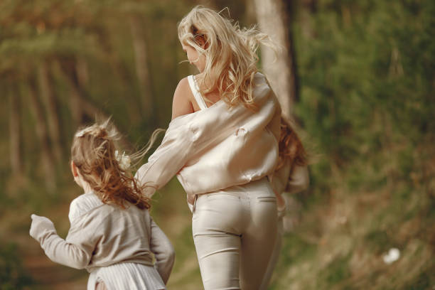 istock Mother with daughter in a summer forest 1326480191