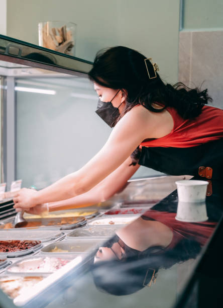 istock scooping ice cream in gelato cafe 1326482368