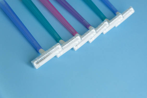 istock Set of multi-colored disposable razors on a blue background. 1326482558