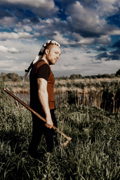 istock A young man with an interesting depicts a Viking with an ax in an unreliable stylized modern costume 1326482593