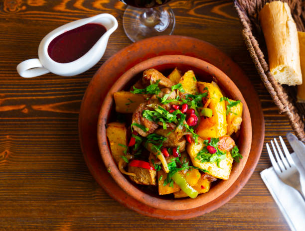 istock Traditional georgian Ojakhuri with pomegranate in earthenware ketsi pan 1326487058