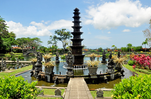 Royal water garden of Tirta Gangga in Bali Indonesia,with beautiful fish pool,statue and water fountain