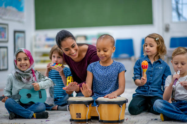 istock Kids playing music in preschool 1326488507