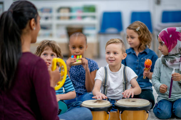istock Kids playing music in preschool 1326488511