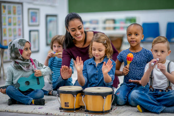 istock Kids playing music in preschool 1326488527