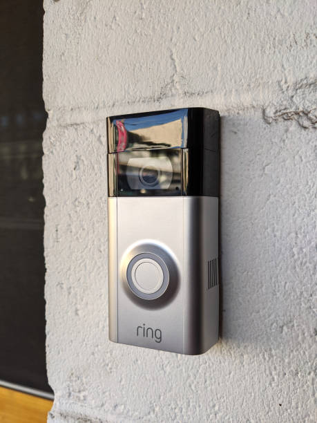 Ring Doorbell 2 mounted on building entrance Honolulu - June 29, 2020:  Ring Doorbell 2 mounted on building entrance.  Rind doorbell is a  video doorbell that lets you see, hear and speak to people from your phone, tablet, or select Echo device. doorbell photos stock pictures, royalty-free photos & images