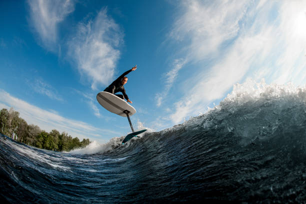 istock bottom view of foilboard on which man effectively jumping on the wave 1326494695