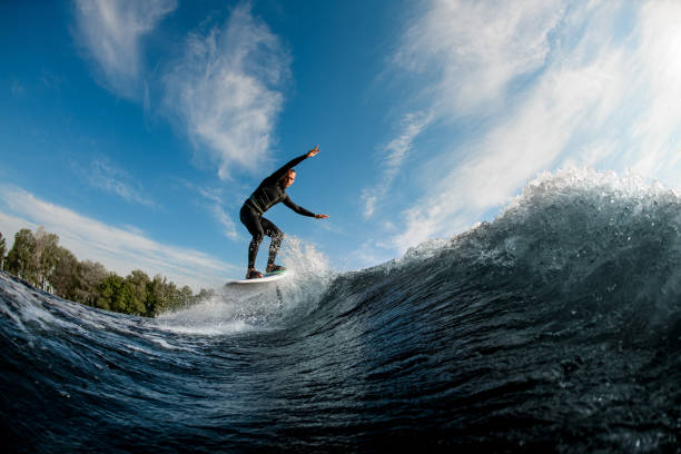 istock active man running on the wave with hydrofoil foil board 1326494870