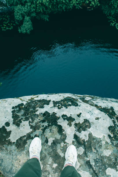 istock person point of view from the cliff at river 1326495006