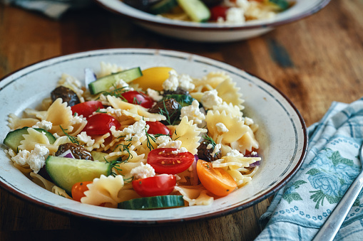 Greek Salad with Farfalle Pasta, Tomato, Cucumber, Bell Pepper, Olives and Feta Cheese