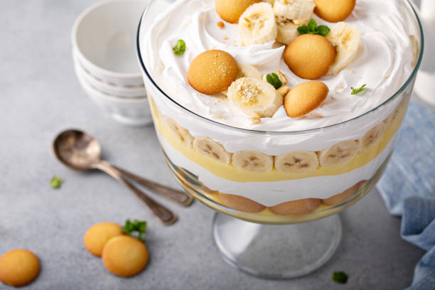 Banana pudding trifle in a large digh Banana pudding trifle with vanilla wafers in a large digh glass trifle stock pictures, royalty-free photos & images